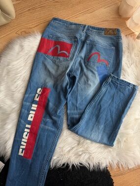 EVISU Graphic Patch Light Wash Jeans with Red Accents